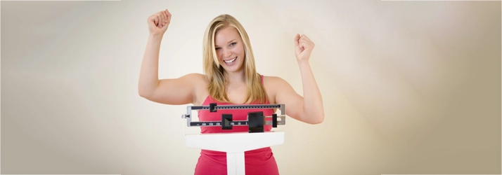 Chiropractic Matthews NC Woman On Scale